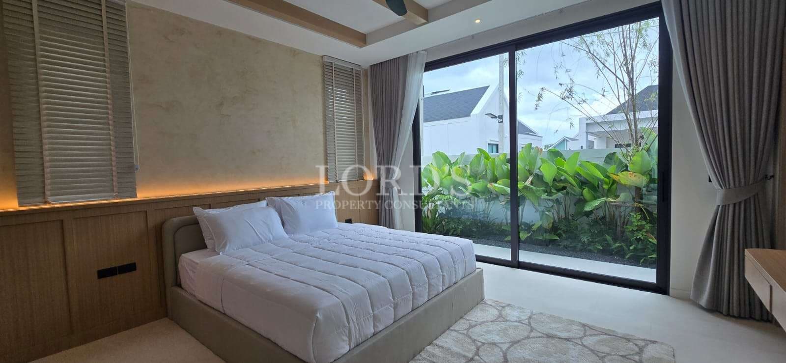 Modern bedroom with large windows