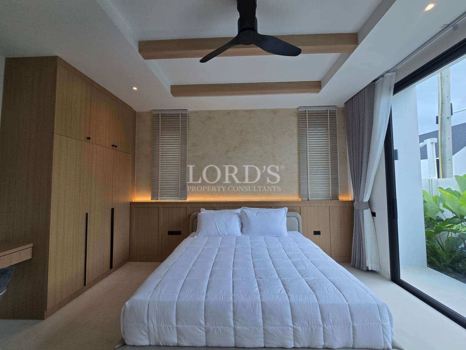 Modern bedroom with large windows