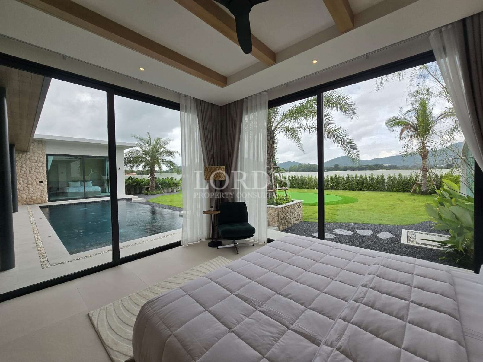 Modern bedroom with pool view