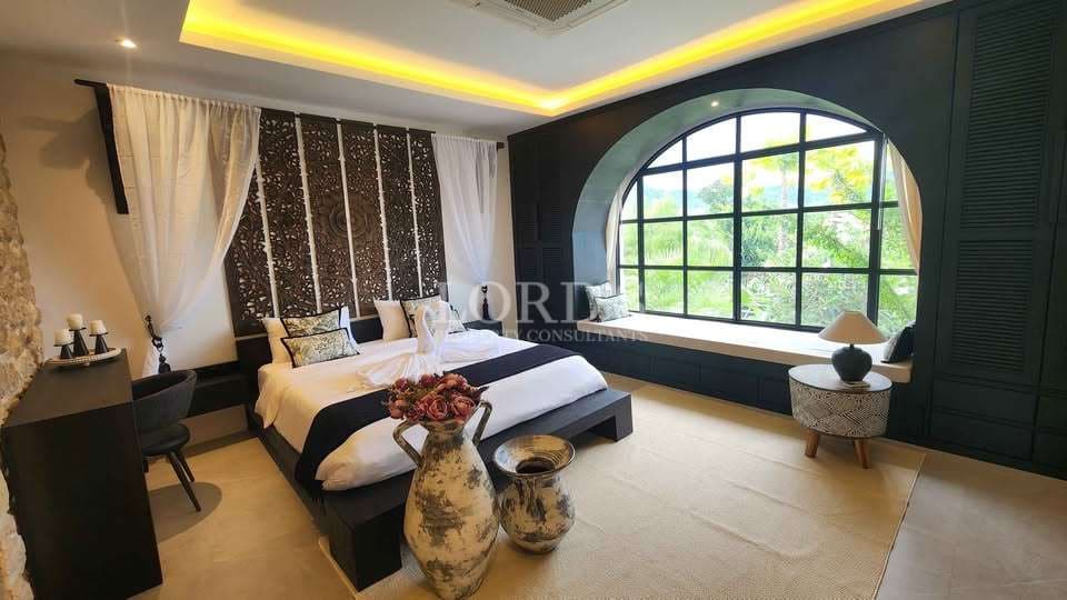 Elegant bedroom with large window
