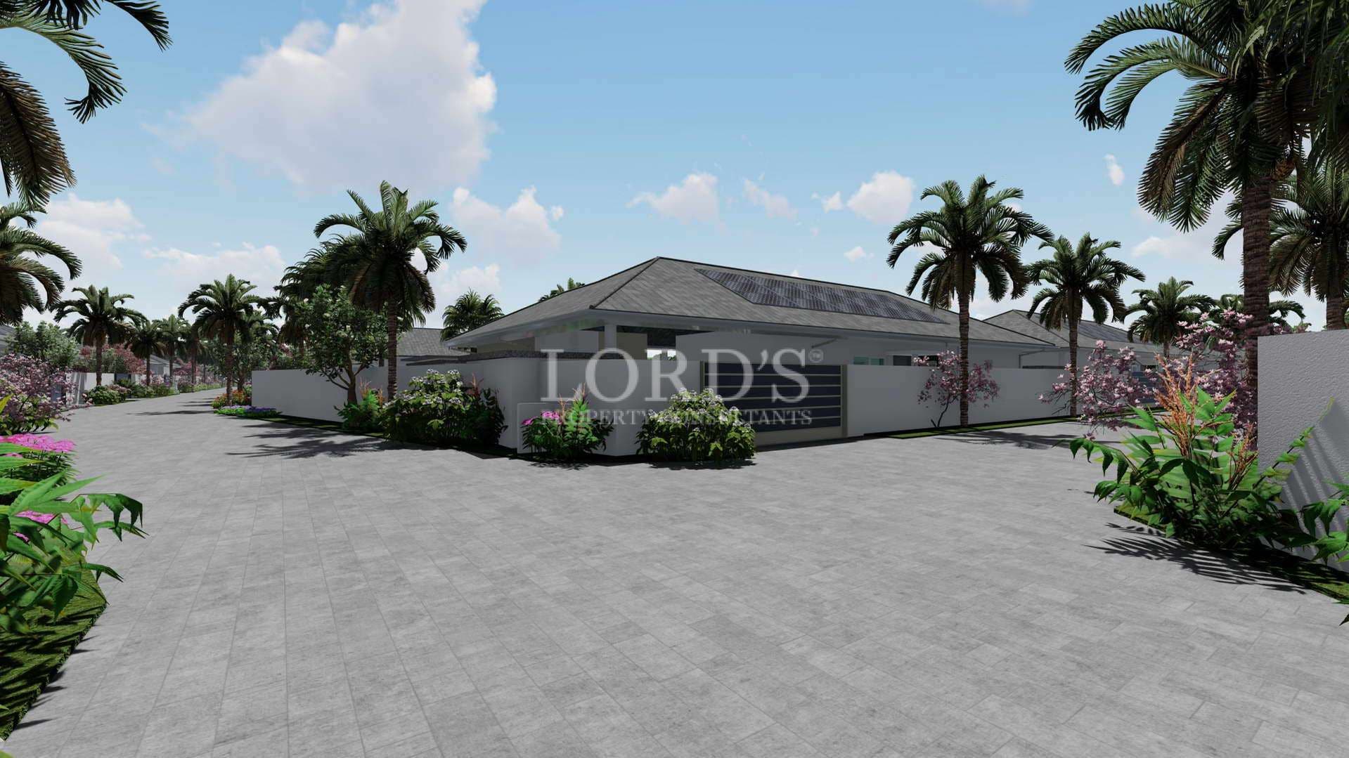 Modern villa exterior with wide paved driveway, tropical landscaping, palm trees, and clean perimeter walls.