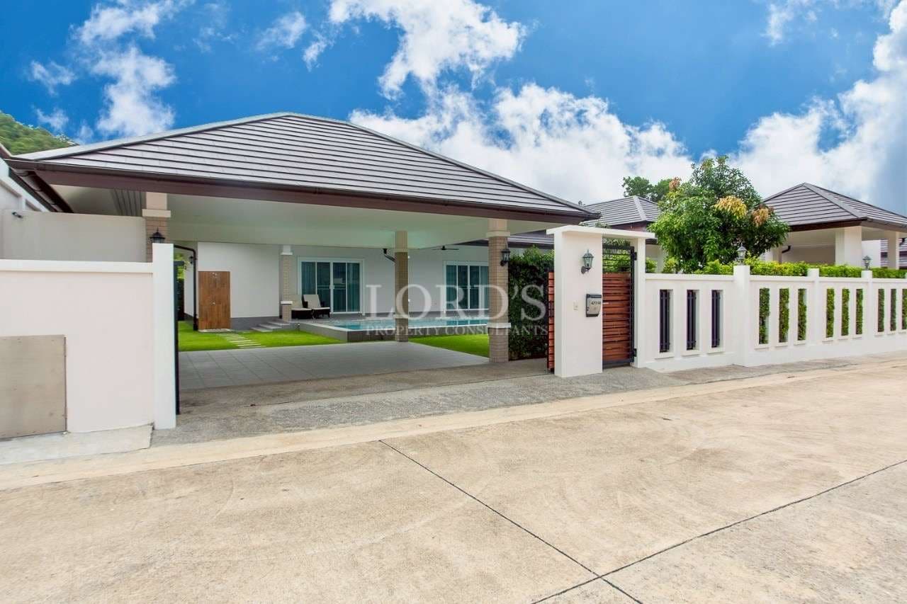 Modern house with landscaped entrance.