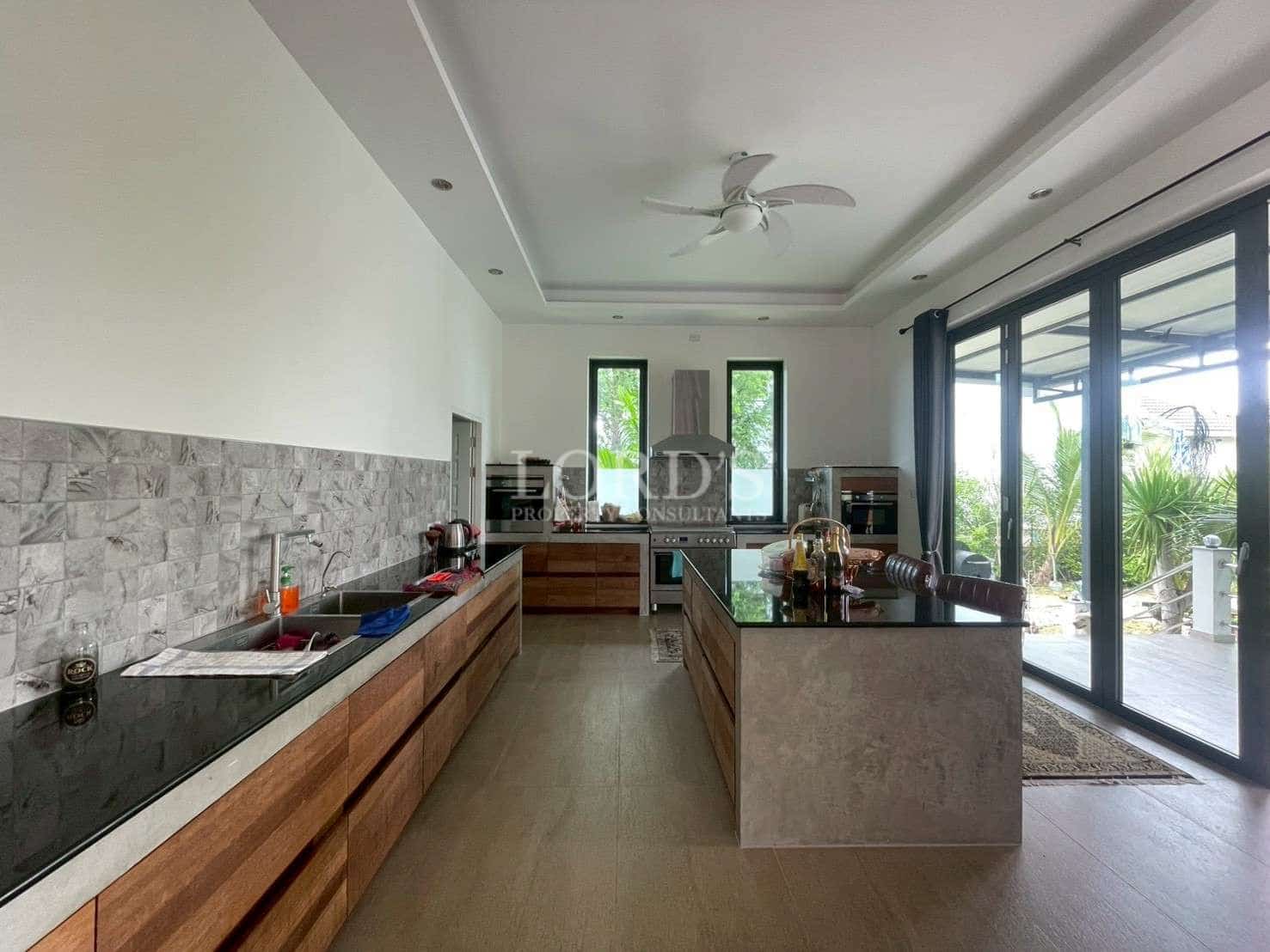 Modern kitchen with wooden cabinets.