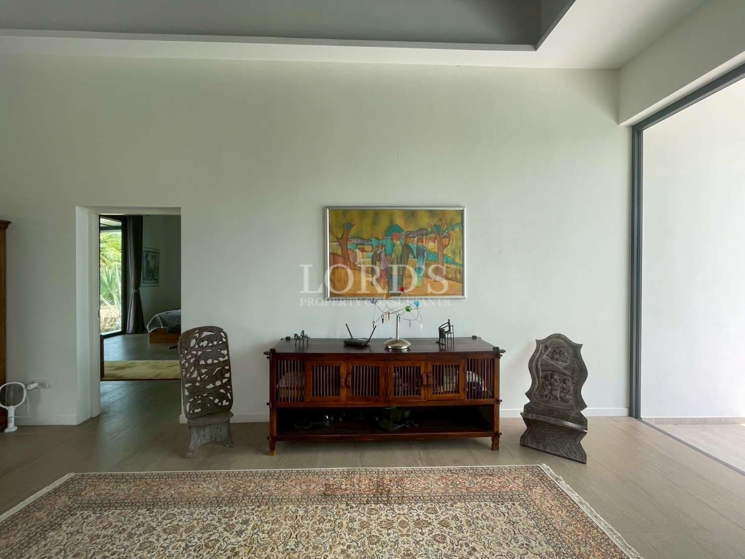 Minimalist room with wooden furniture.