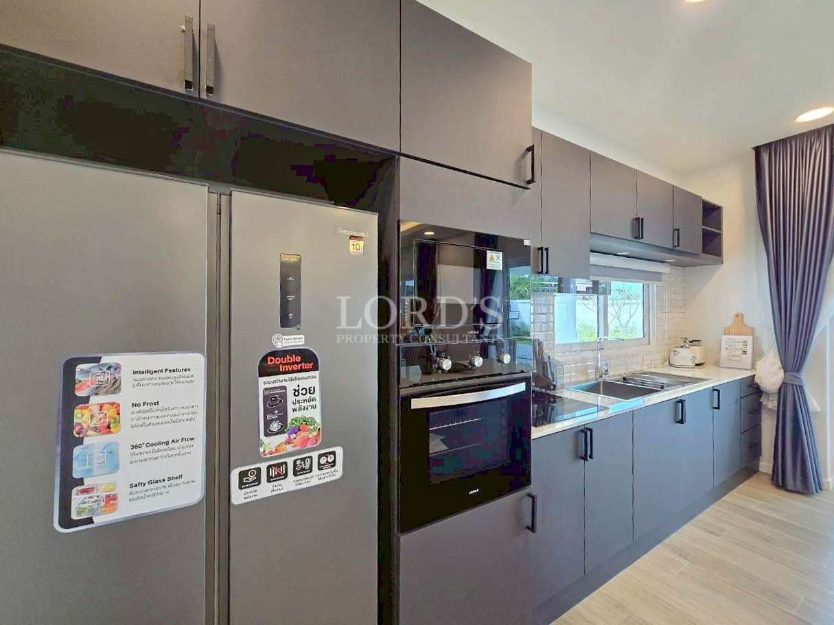 Modern patio with pool and greenery