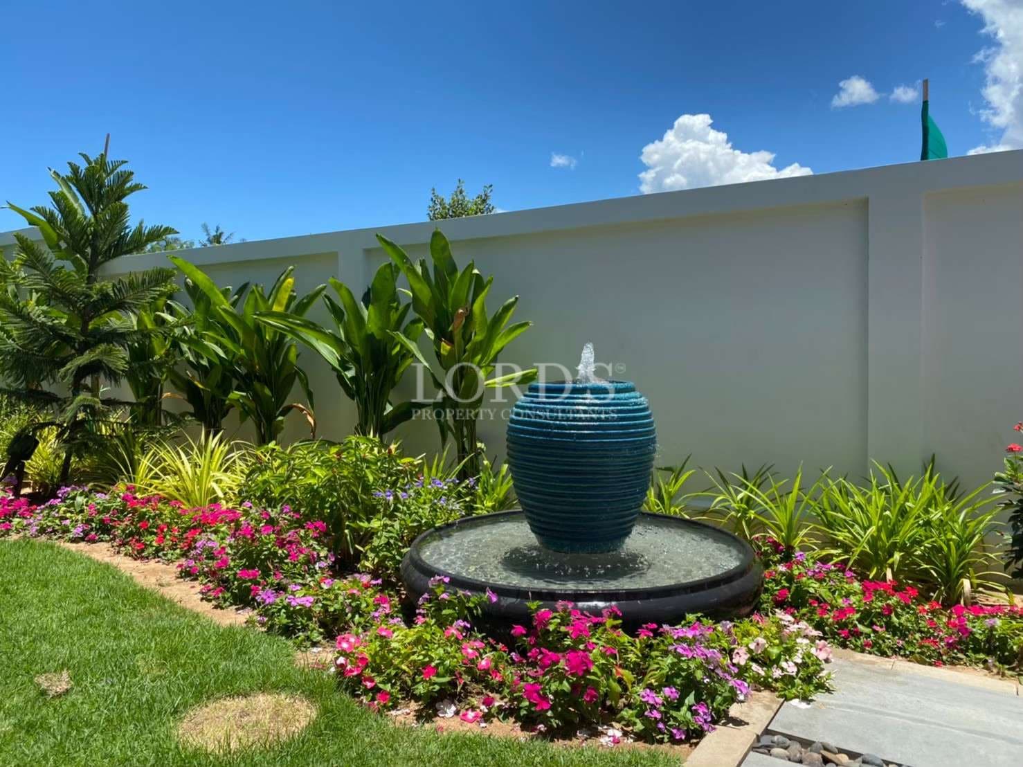 Colorful garden with decorative fountain