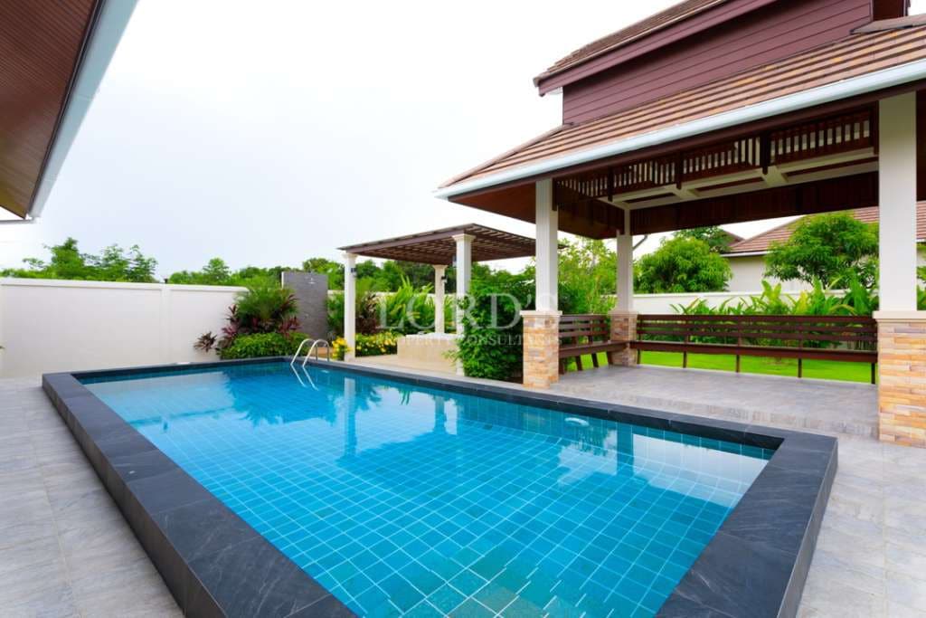 Modern poolside with covered seating