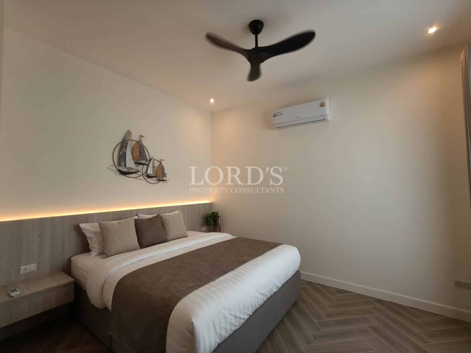 Modern bedroom with neutral tones.