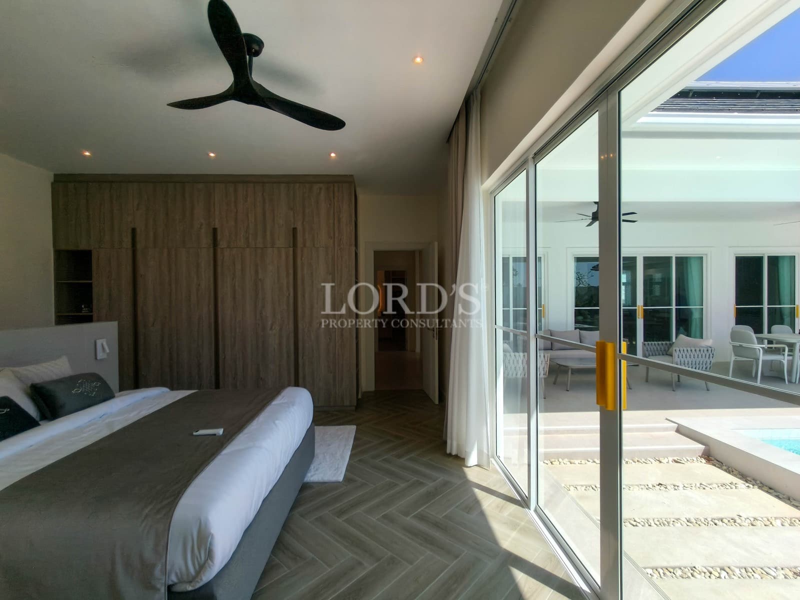 Modern bedroom with patio view