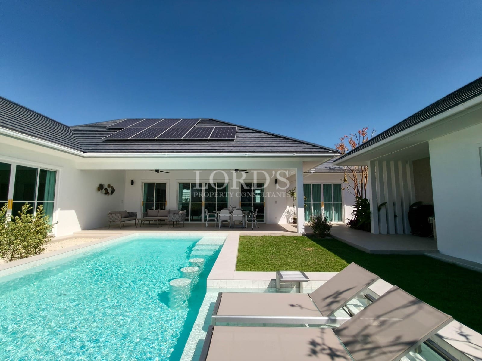 Modern house with pool and solar panels