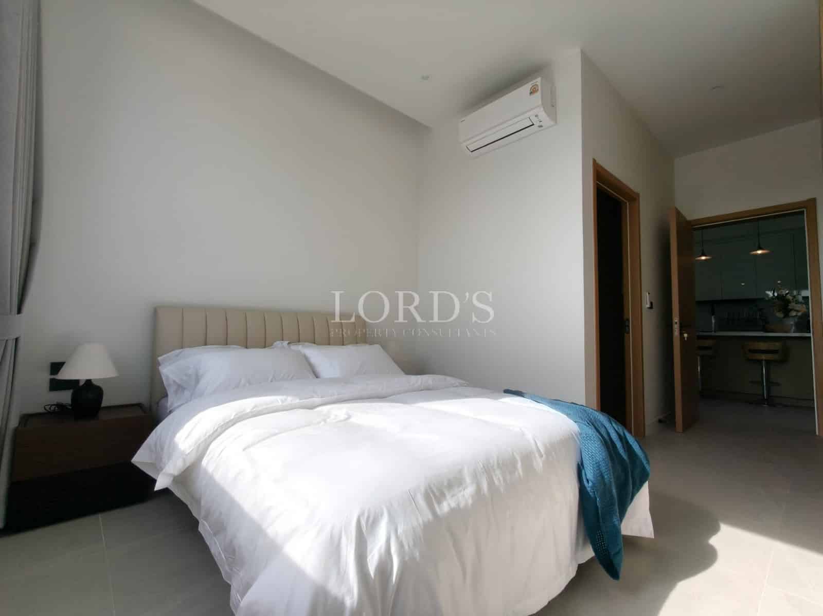 Modern bedroom with white bedding