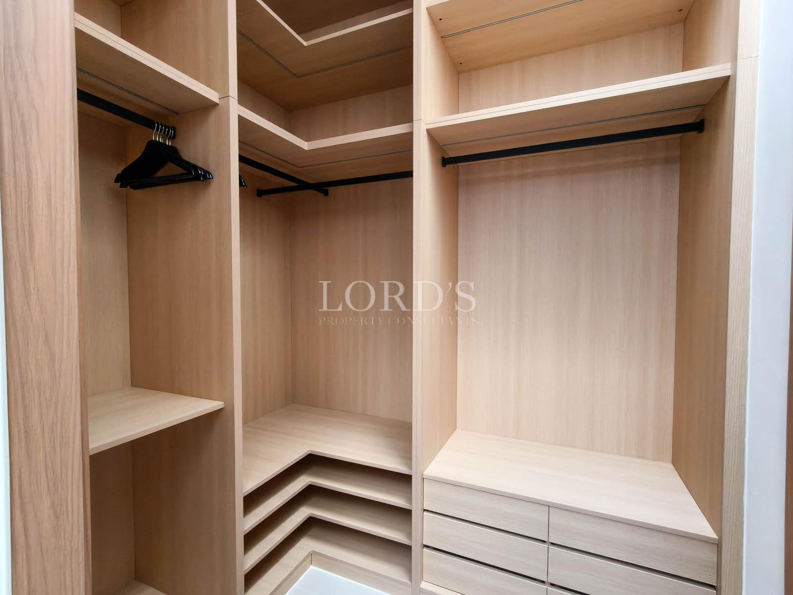Empty wooden closet with shelves