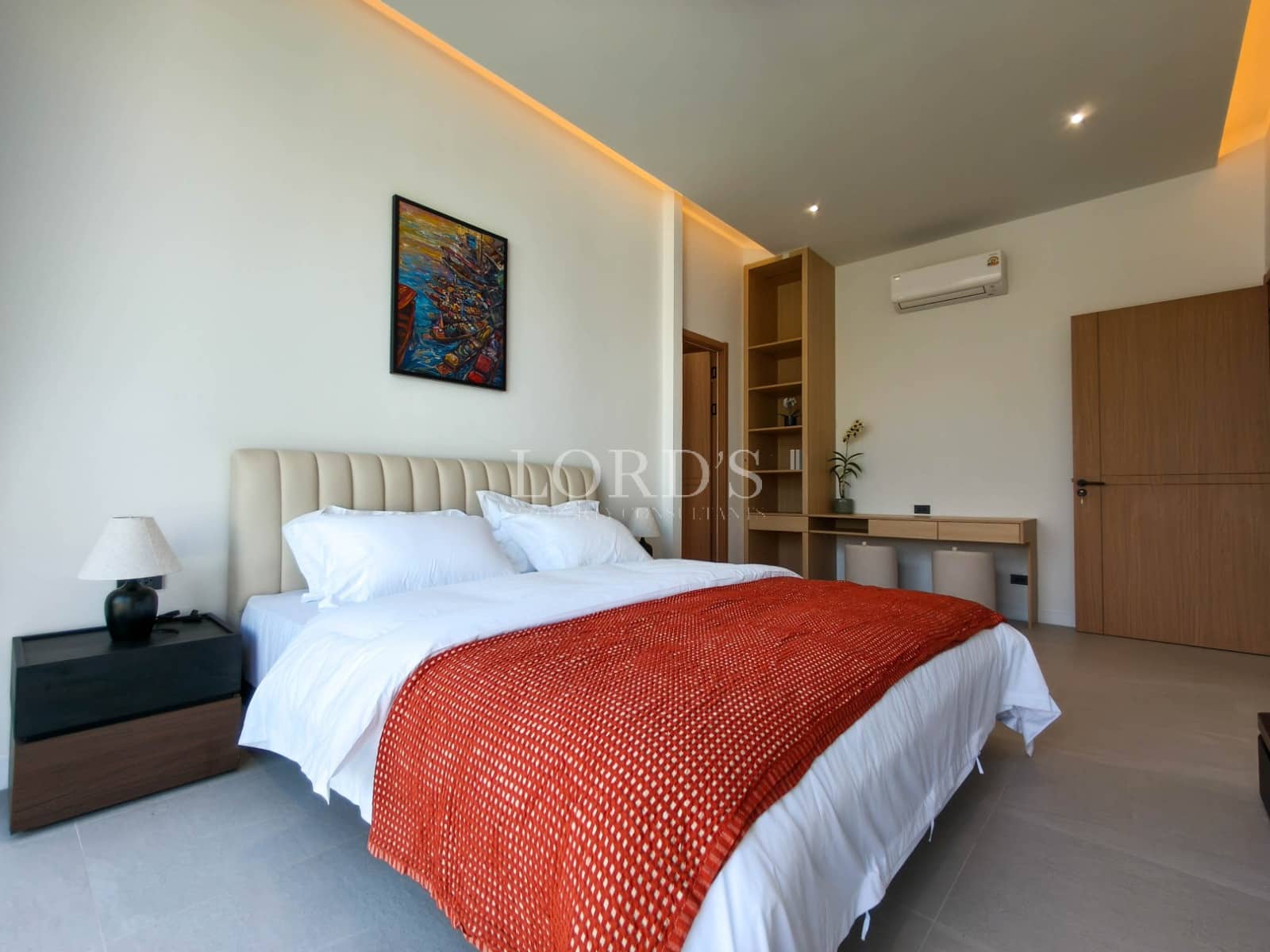 Modern bedroom with orange accents