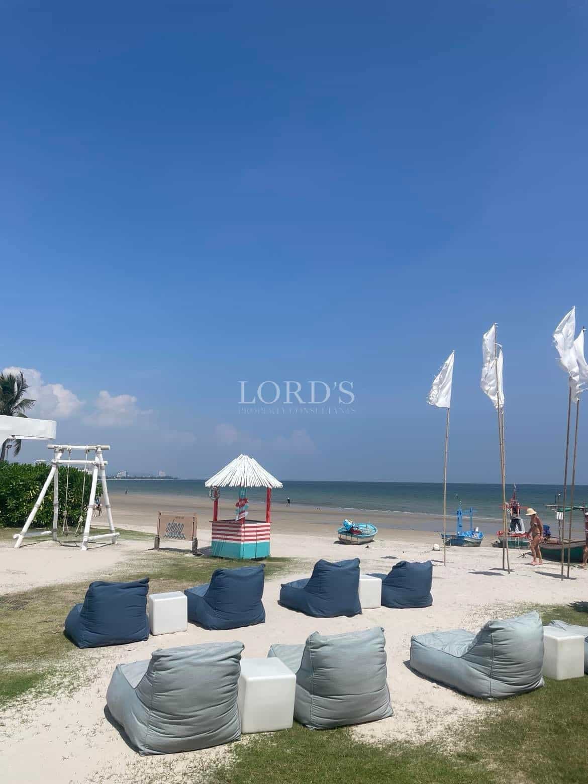 Beach scene with seating and flags