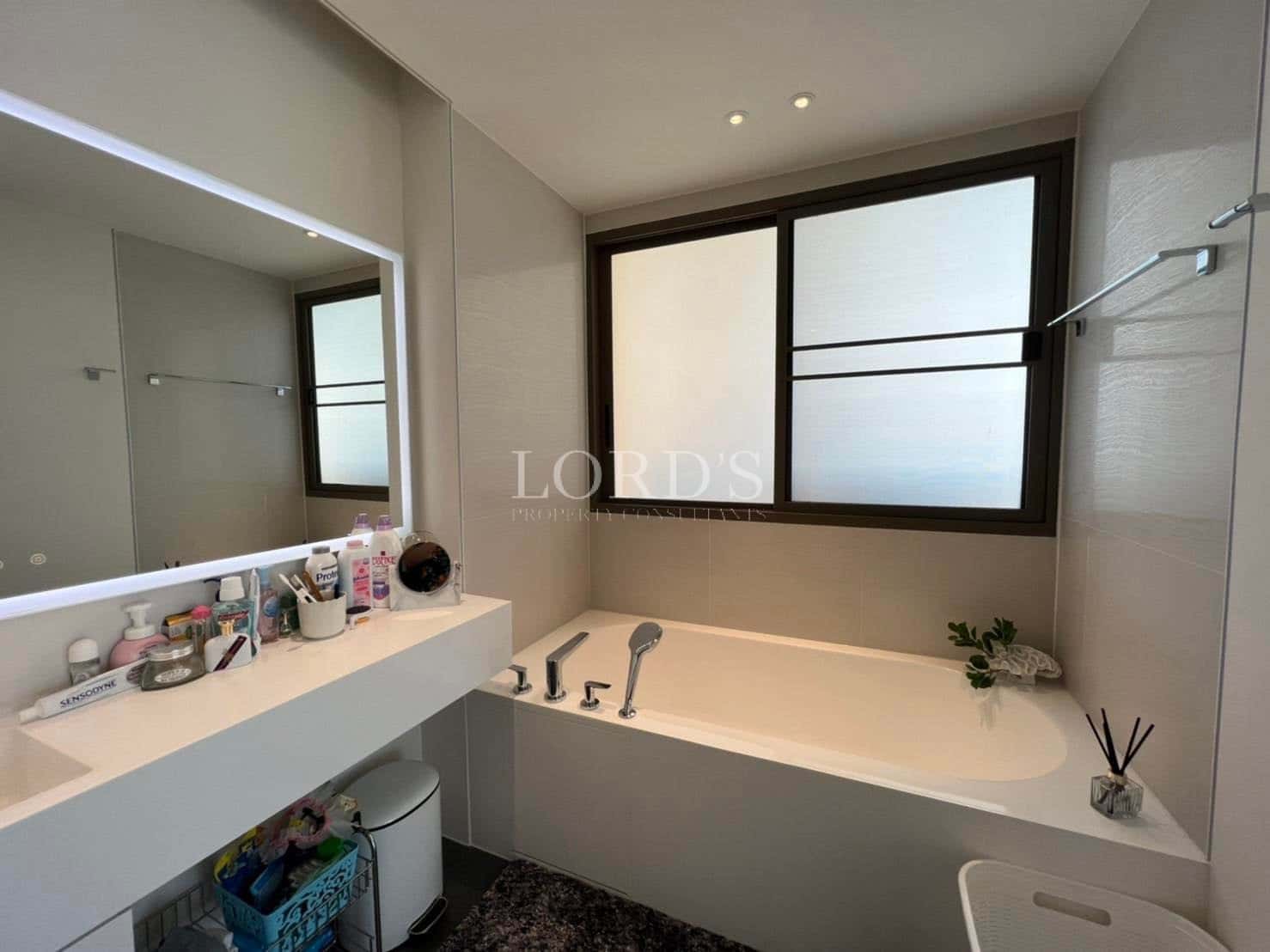 Modern bathroom with bathtub and mirror