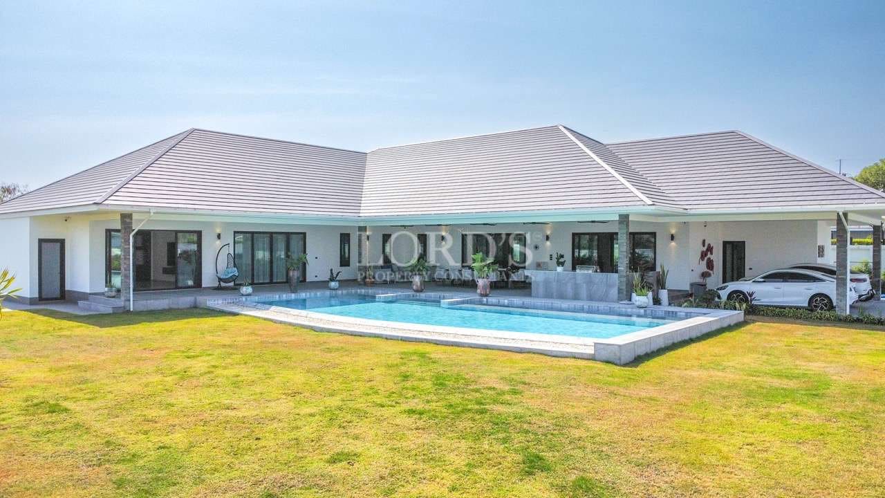 Modern house with pool and lawn