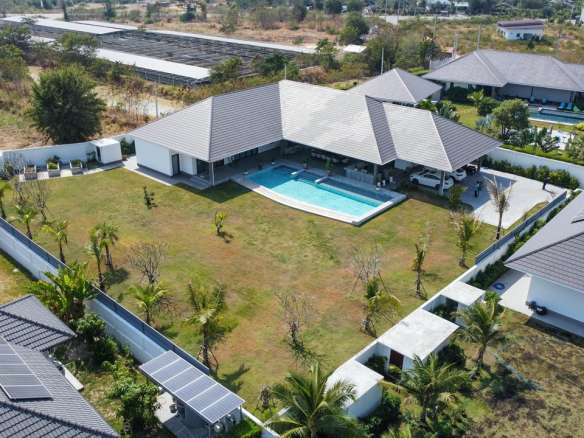Aerial view of luxurious villa complex.