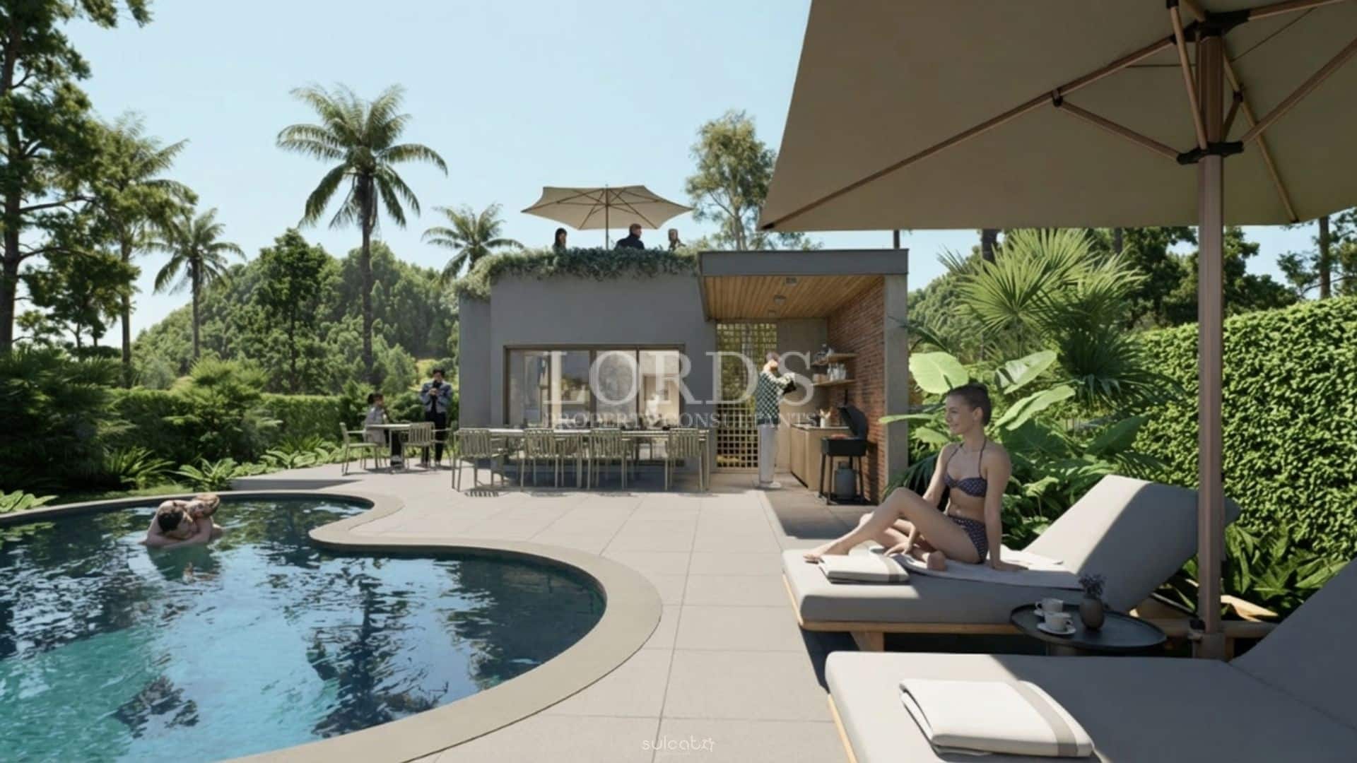 Luxury villa poolside with sun loungers, outdoor kitchen, and tropical garden setting