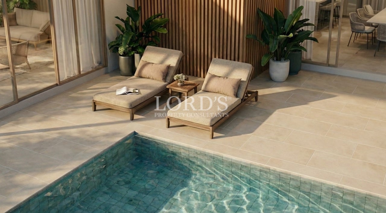Poolside lounge chairs beside swimming pool