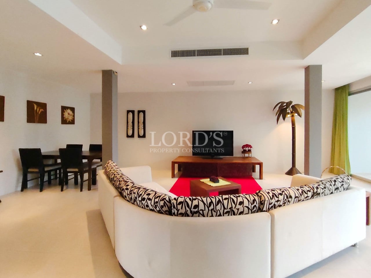 Spacious modern villa living and dining area with open-plan layout.