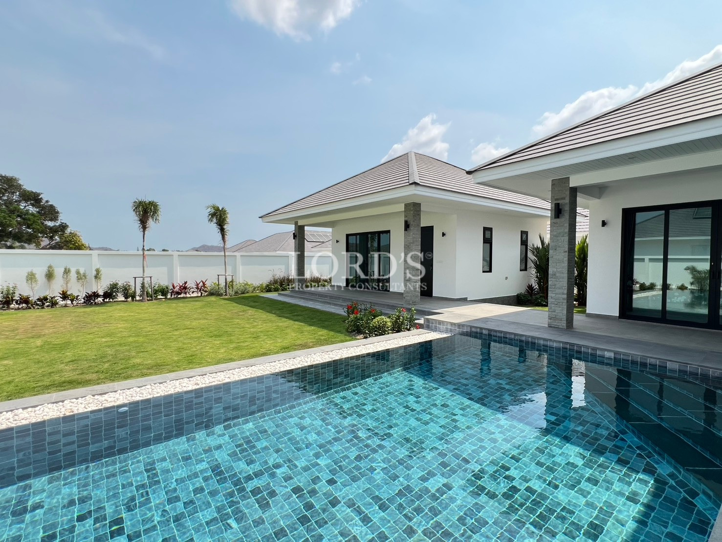 Modern single-story villa with private swimming pool and landscaped garden