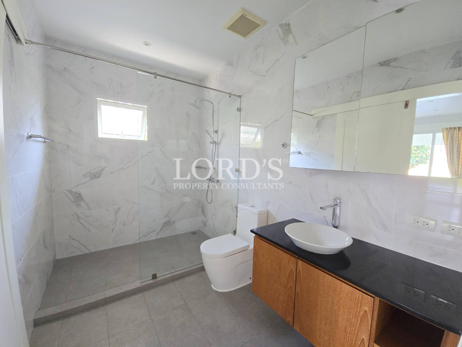 Bathroom with marble walls and sink