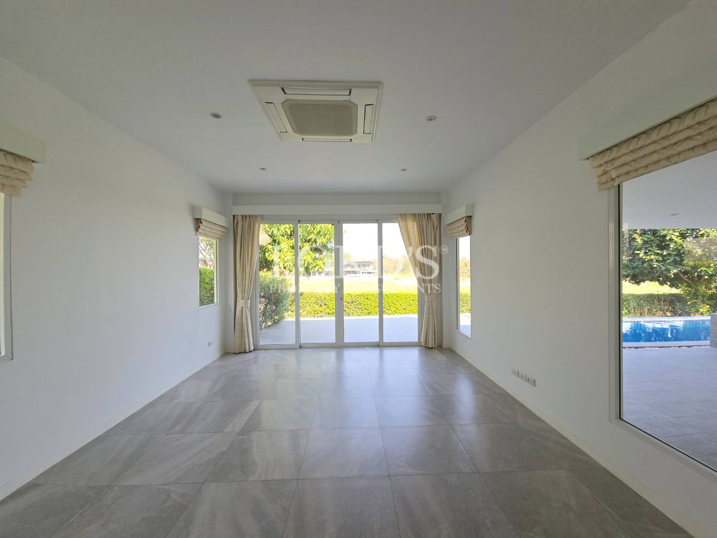 Empty room with sliding glass doors