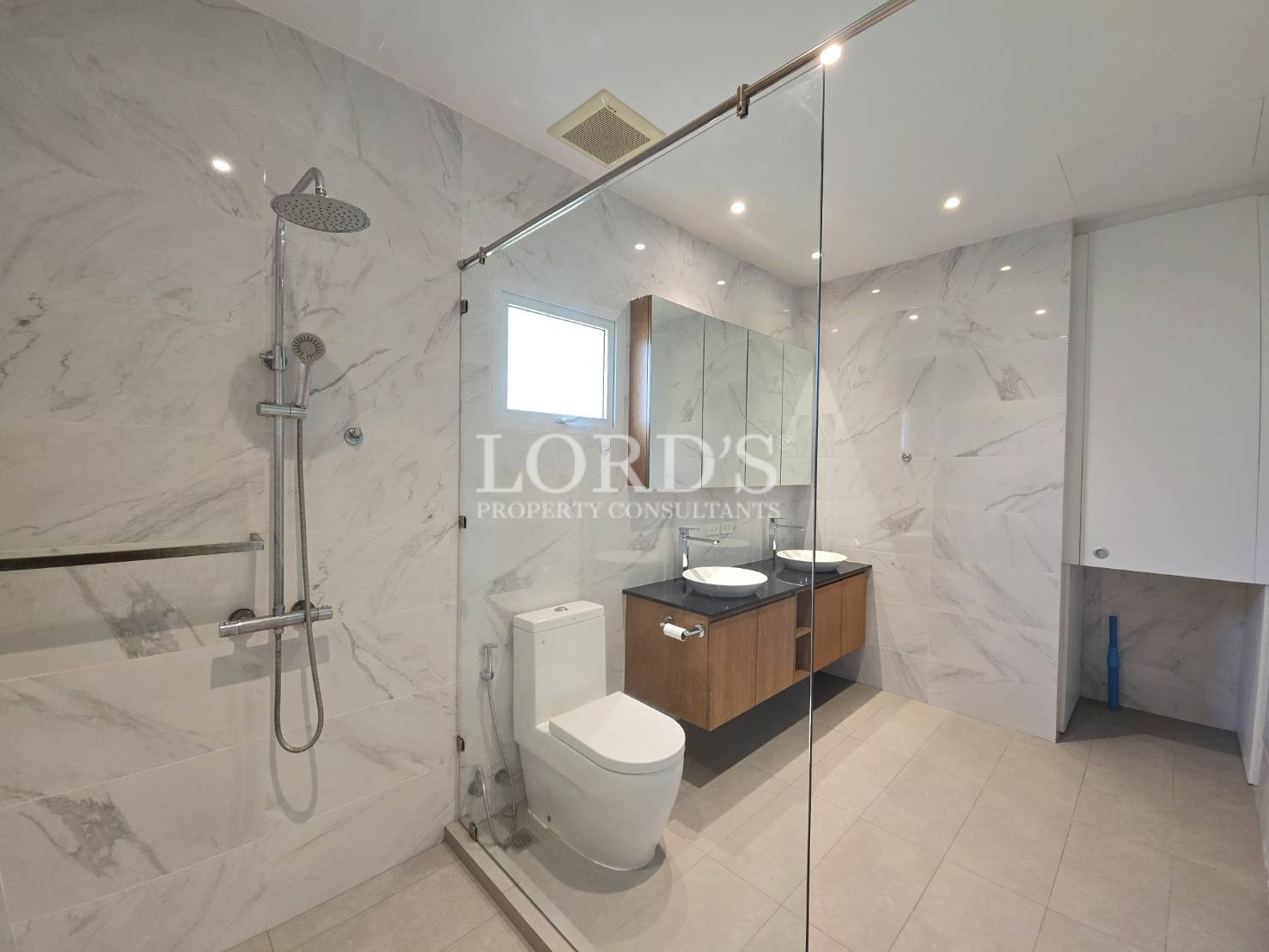 Bathroom with shower and vanity
