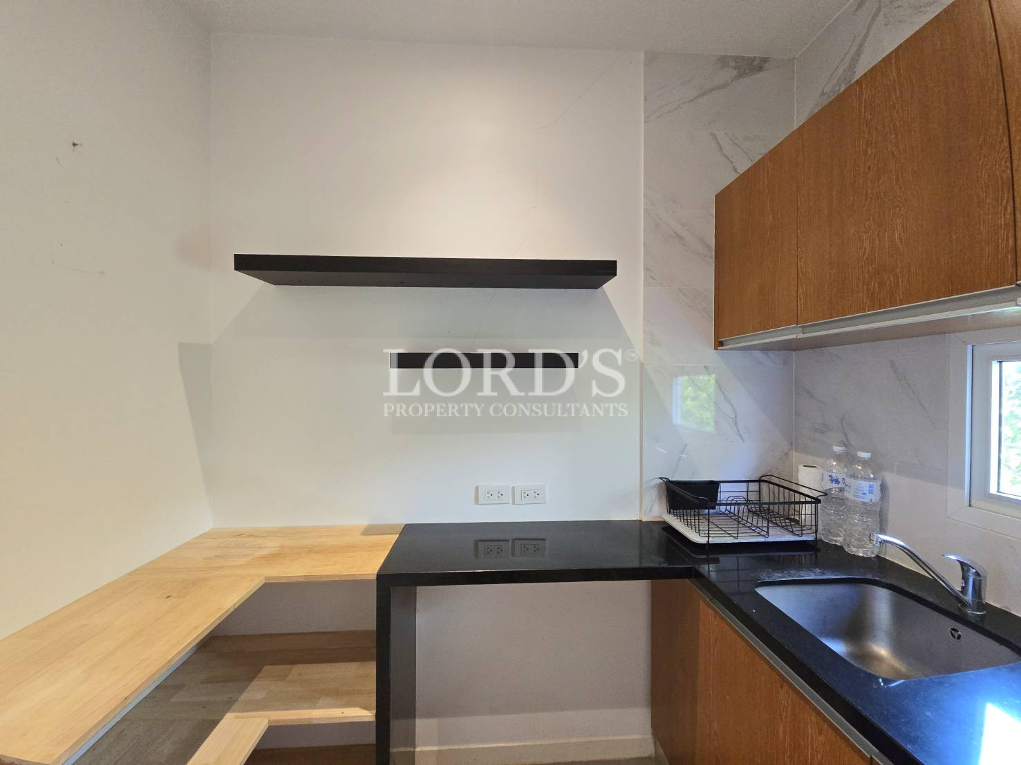 Kitchen with wooden cabinets and counter