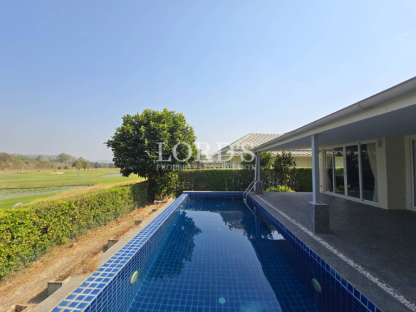 Poolside view along house exterior