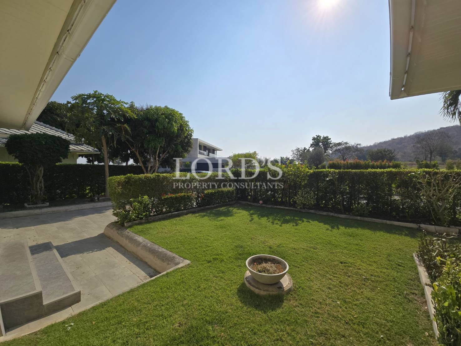 Garden with open field and mountains