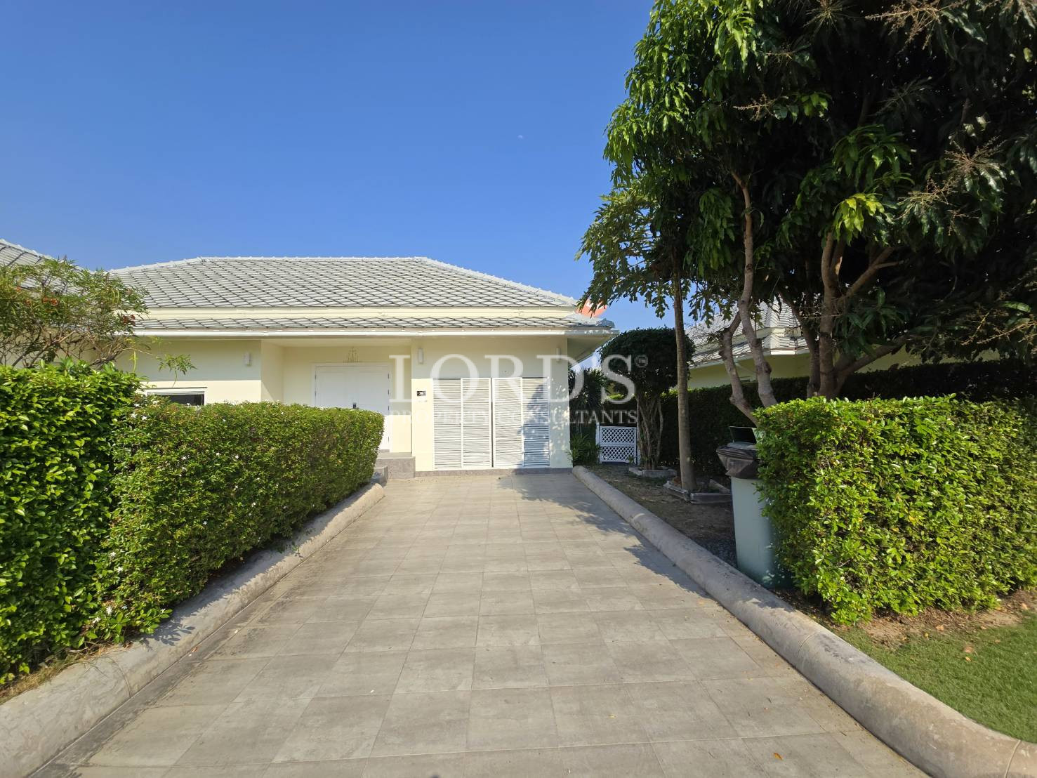 Driveway leading to house entrance