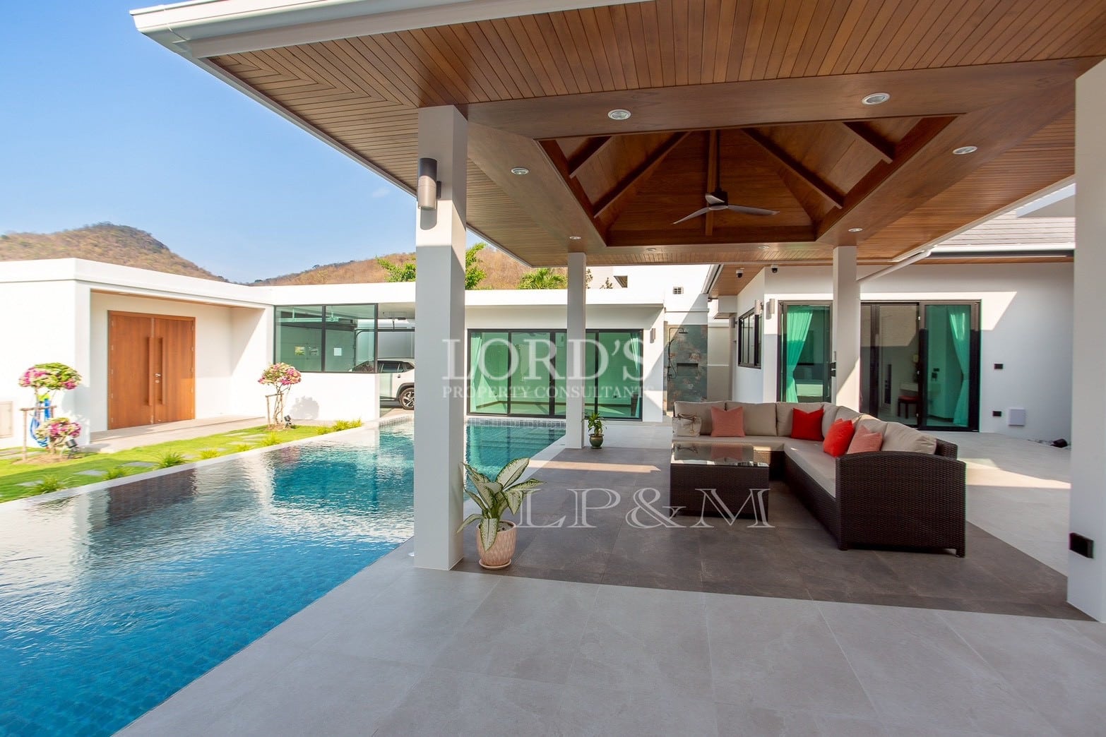 Covered patio beside swimming pool