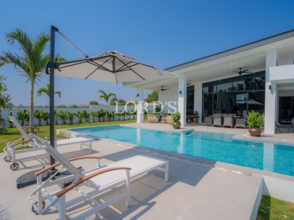 Outdoor pool area with sun loungers