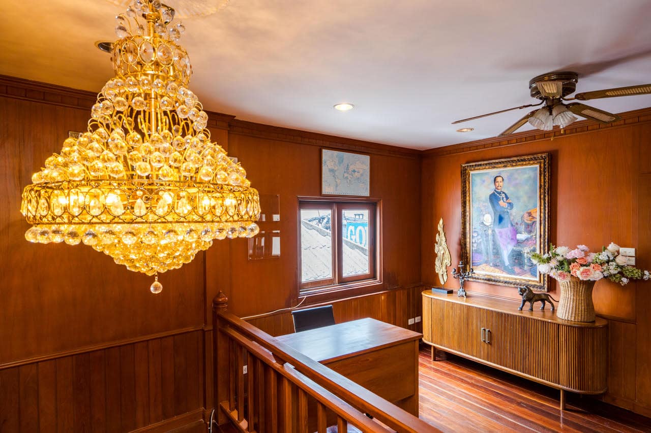 Staircase with chandelier and wooden interior