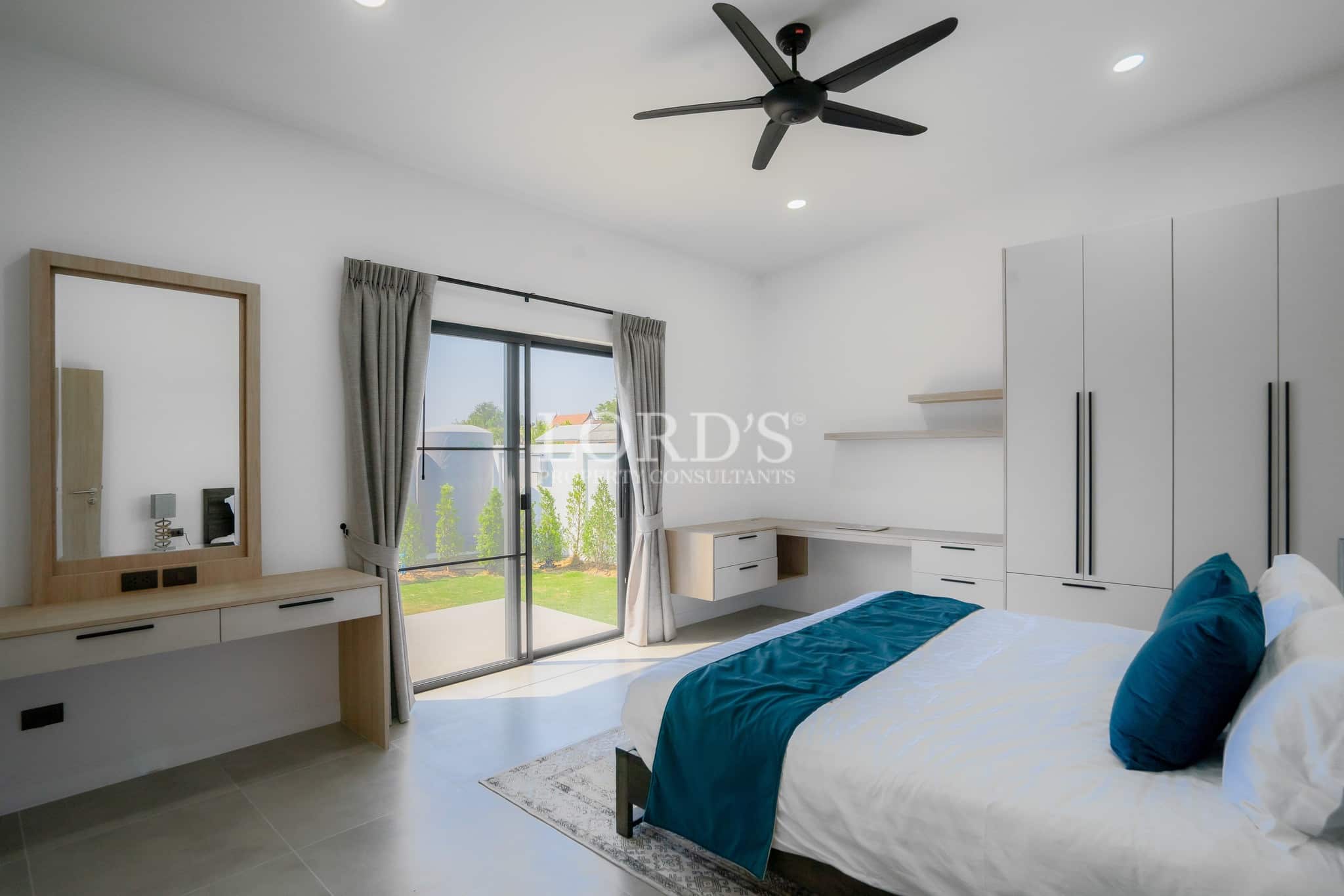 Bedroom with balcony doors and natural light