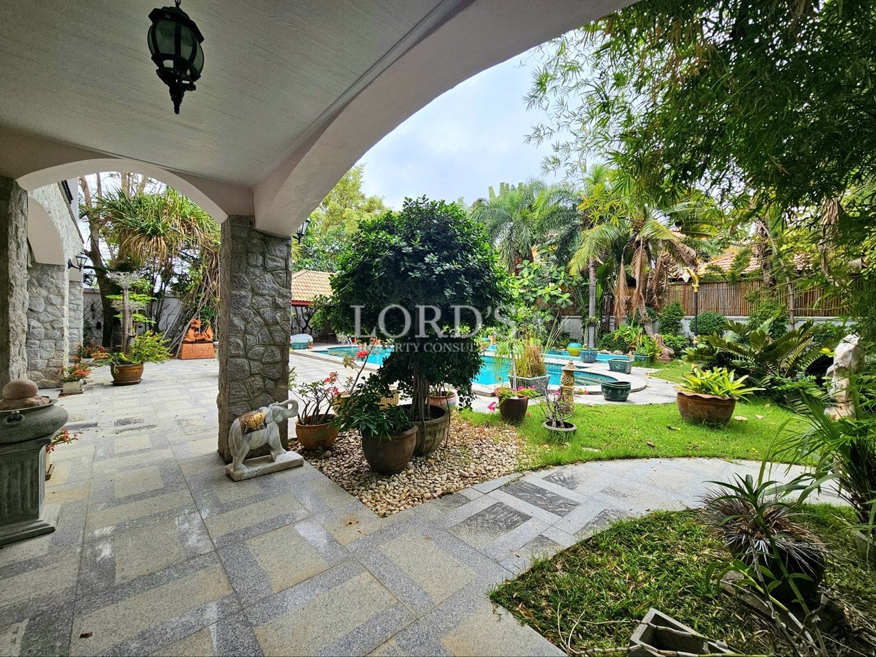 Covered outdoor walkway with garden view