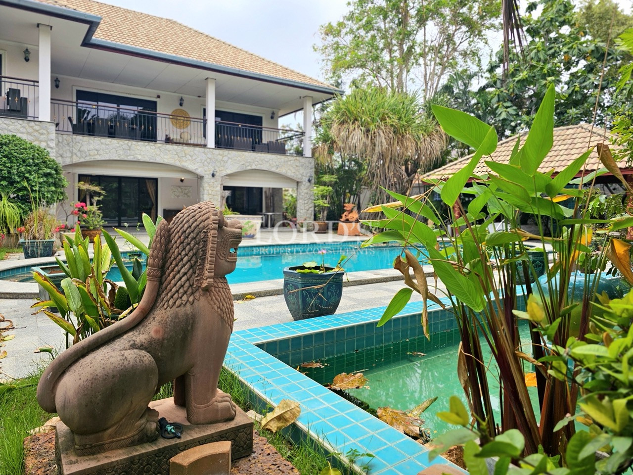 Decorative garden statue near the swimming pool