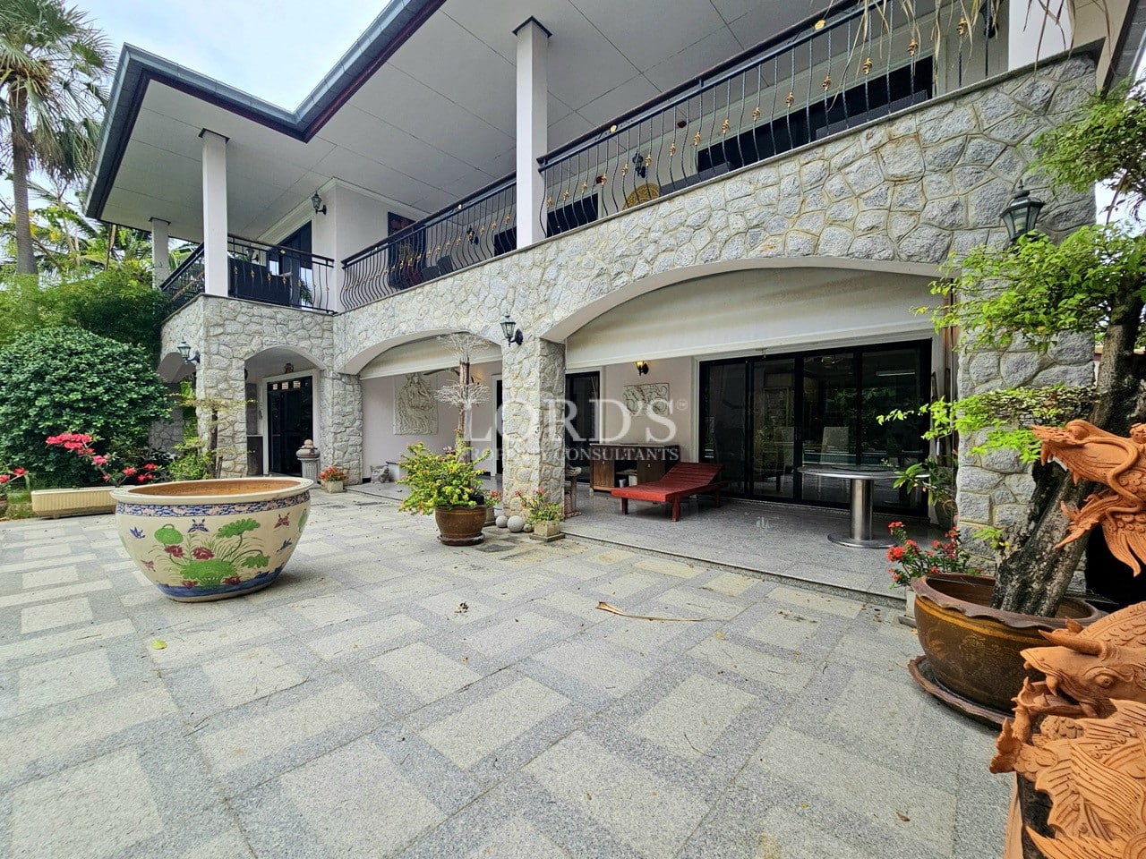 Private swimming pool surrounded by tropical garden