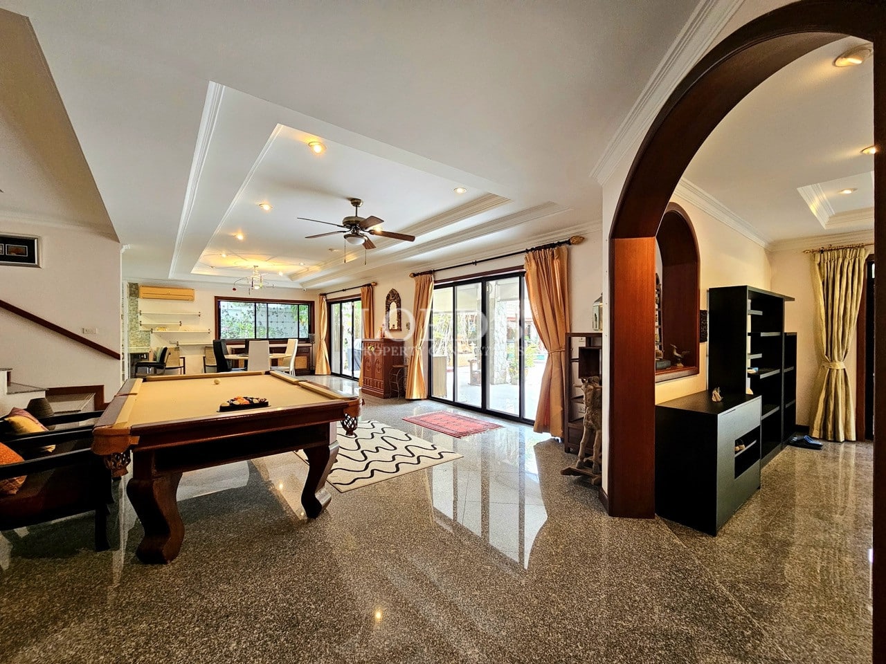 Entertainment room with pool table and seating area