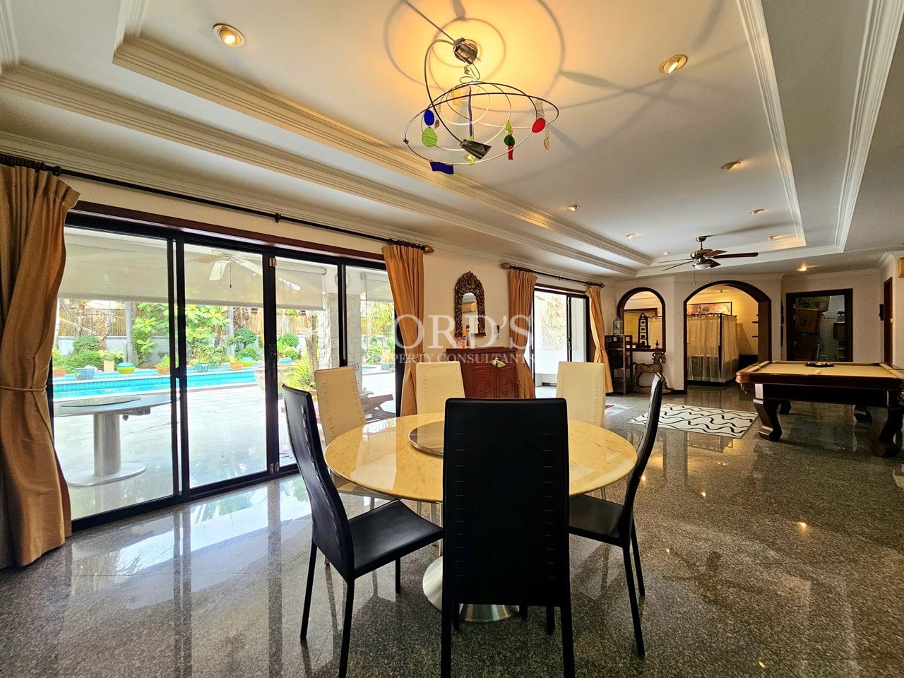 Dining area with chandelier and garden view