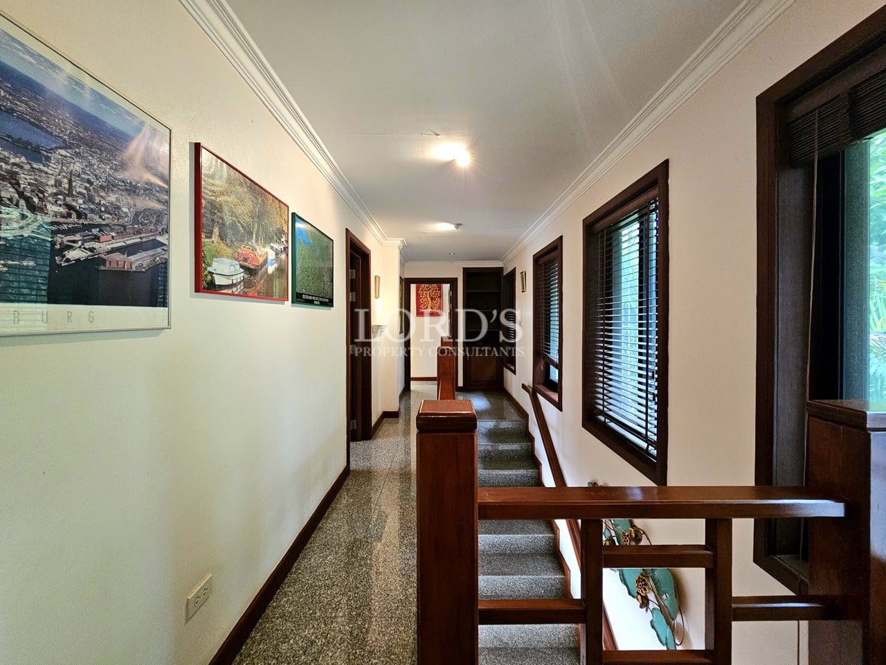 Hallway with staircase and modern railing