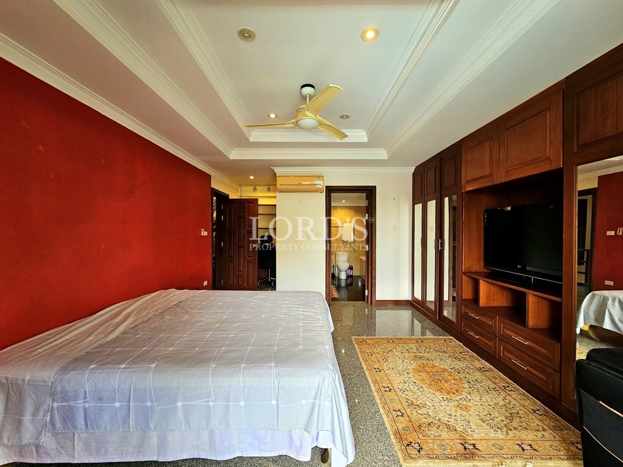 Bedroom with modern lighting and wooden furniture