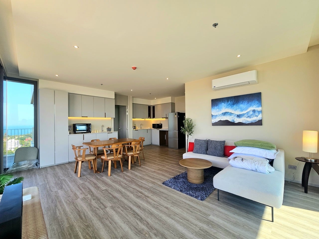 Living room with sofa and dining table near window