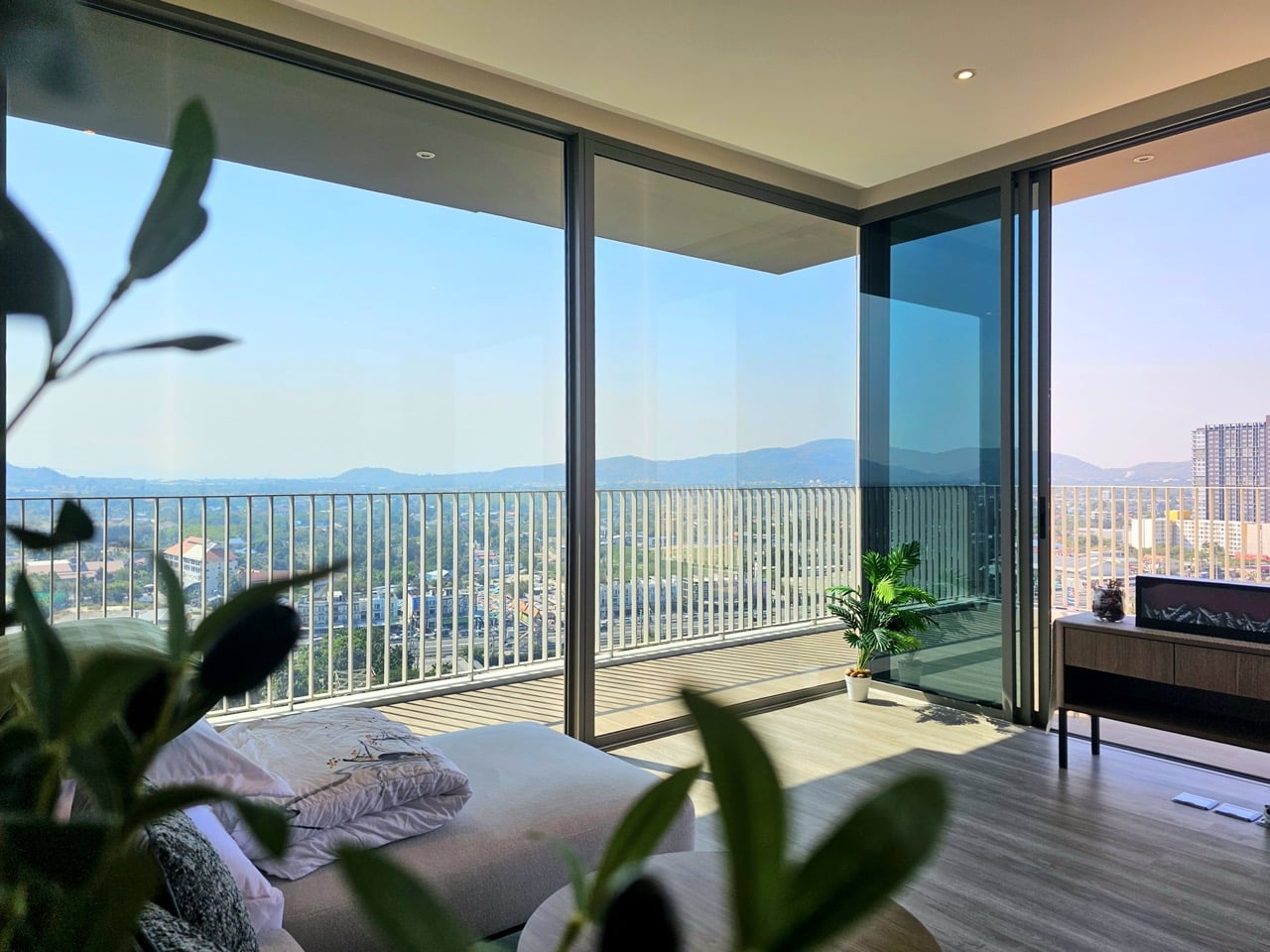 Bedroom with balcony and mountain view