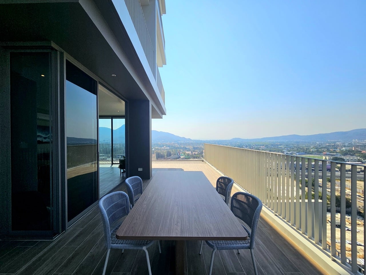 Balcony seating area with panoramic city view