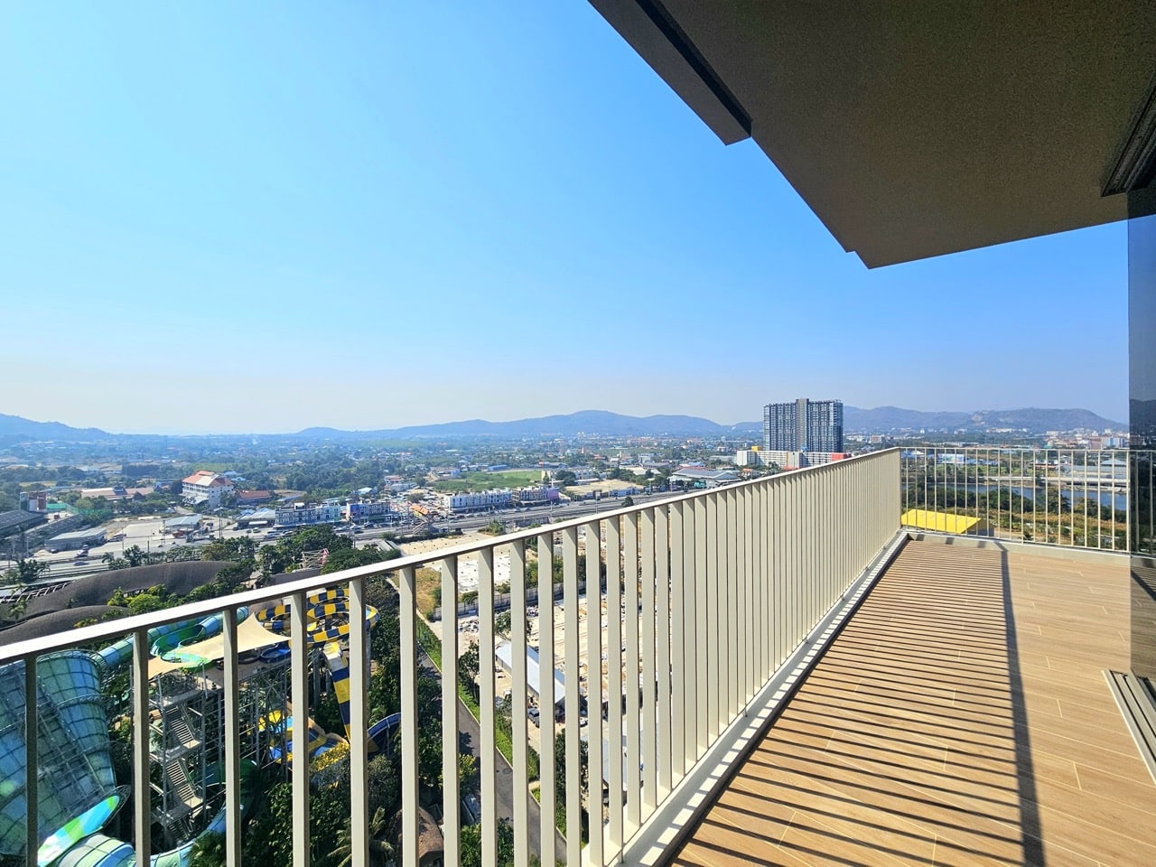 Balcony with wooden floor and railing view