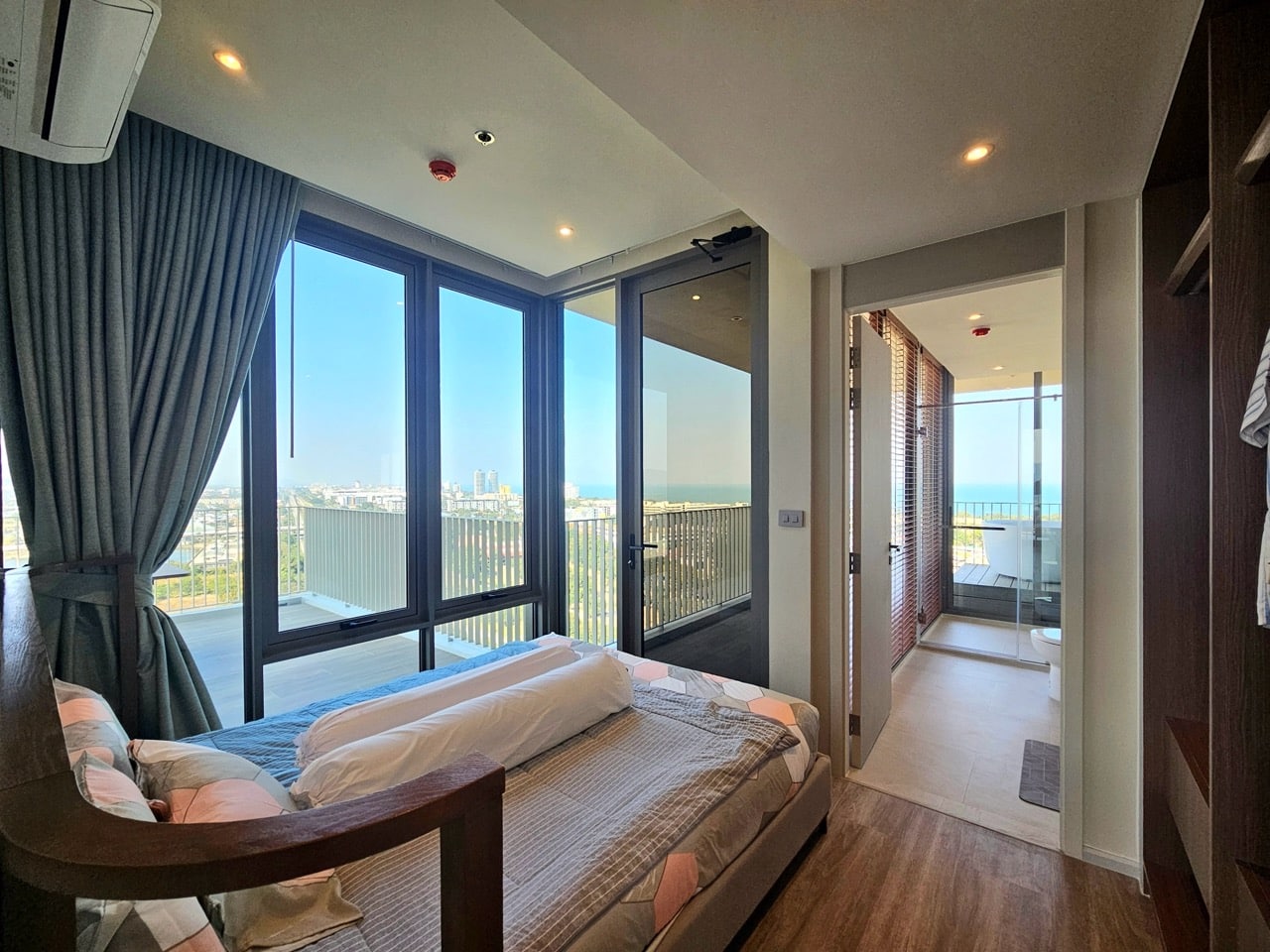 Bedroom with glass doors and balcony view