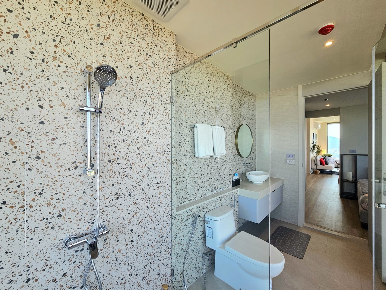 Bathroom with shower and patterned tiles