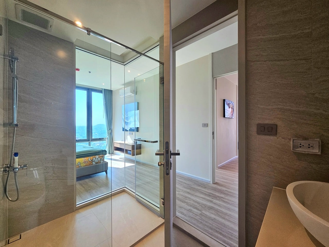 Bathroom with glass partition and sink